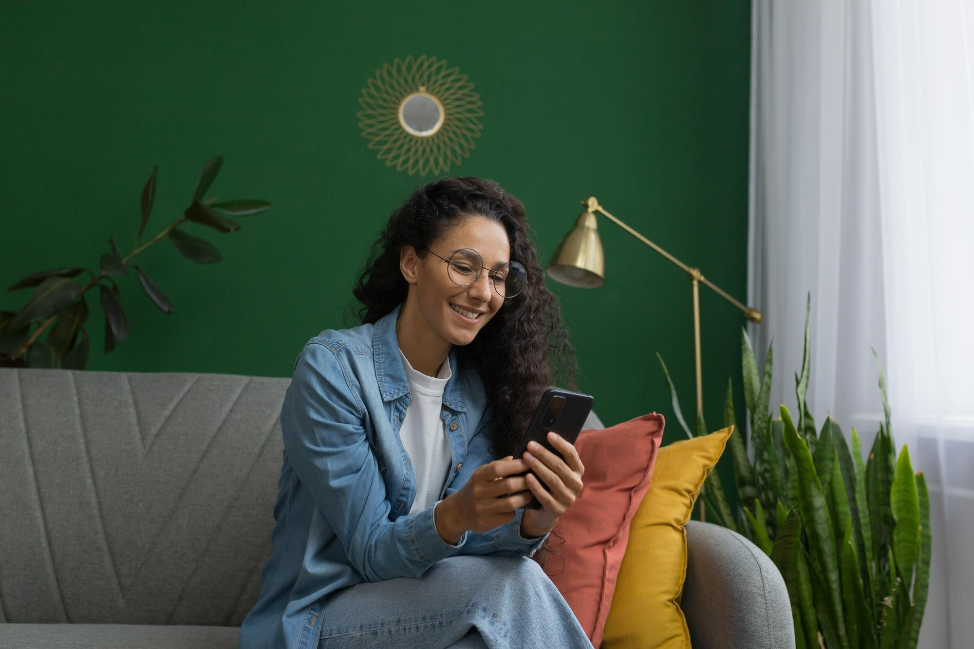 woman sitting in Living room checking her phone